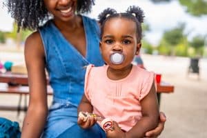 Baby with pacifier photo